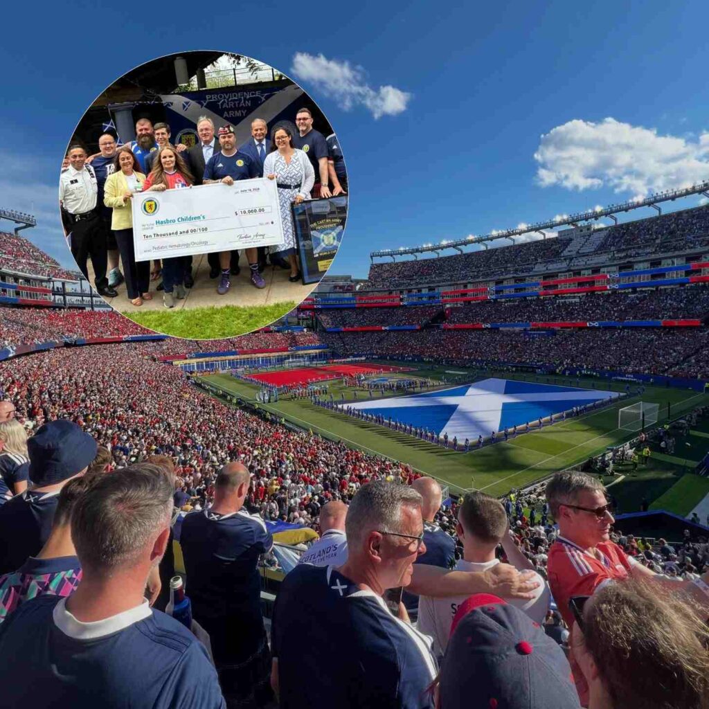 Torcedores escoceses em estádio lotado, com bandeira da Escócia e cheque gigante para a Hasbro Children's.